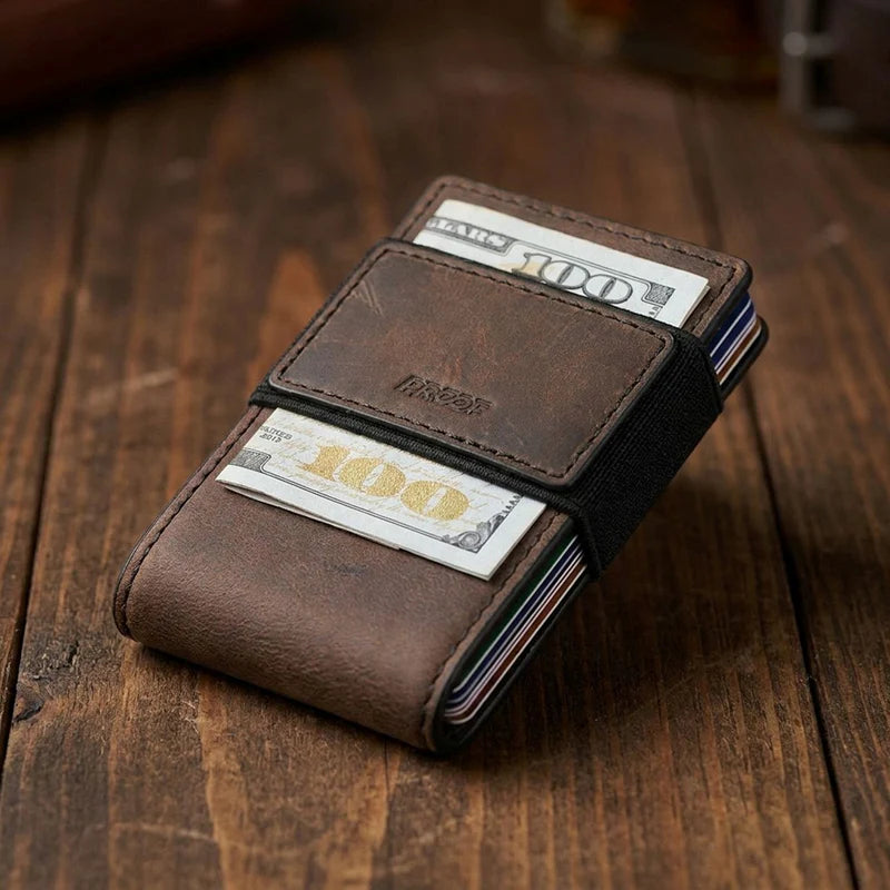 Brown leather wallet with money holder on a wooden surface