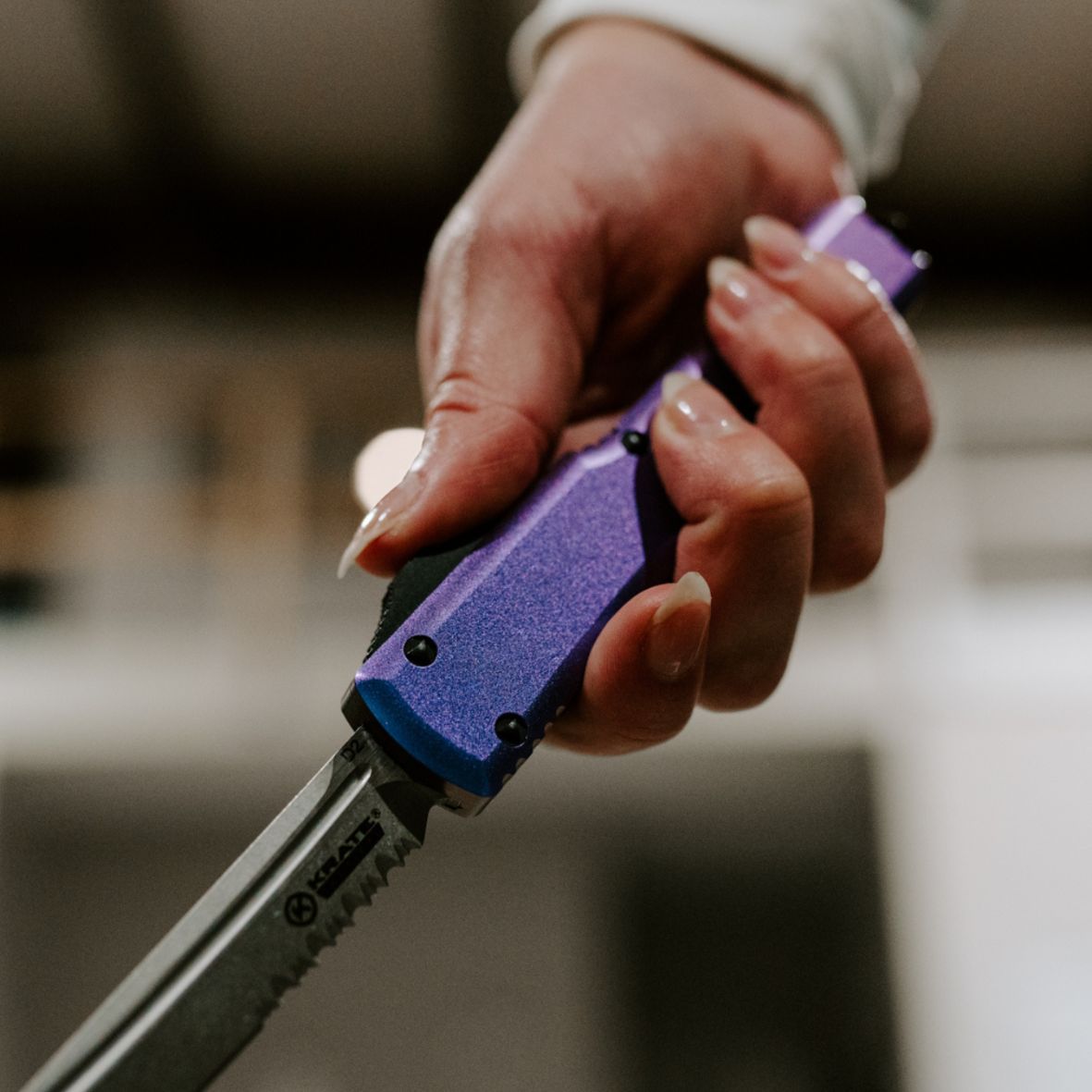 nightshade otf knife in hand