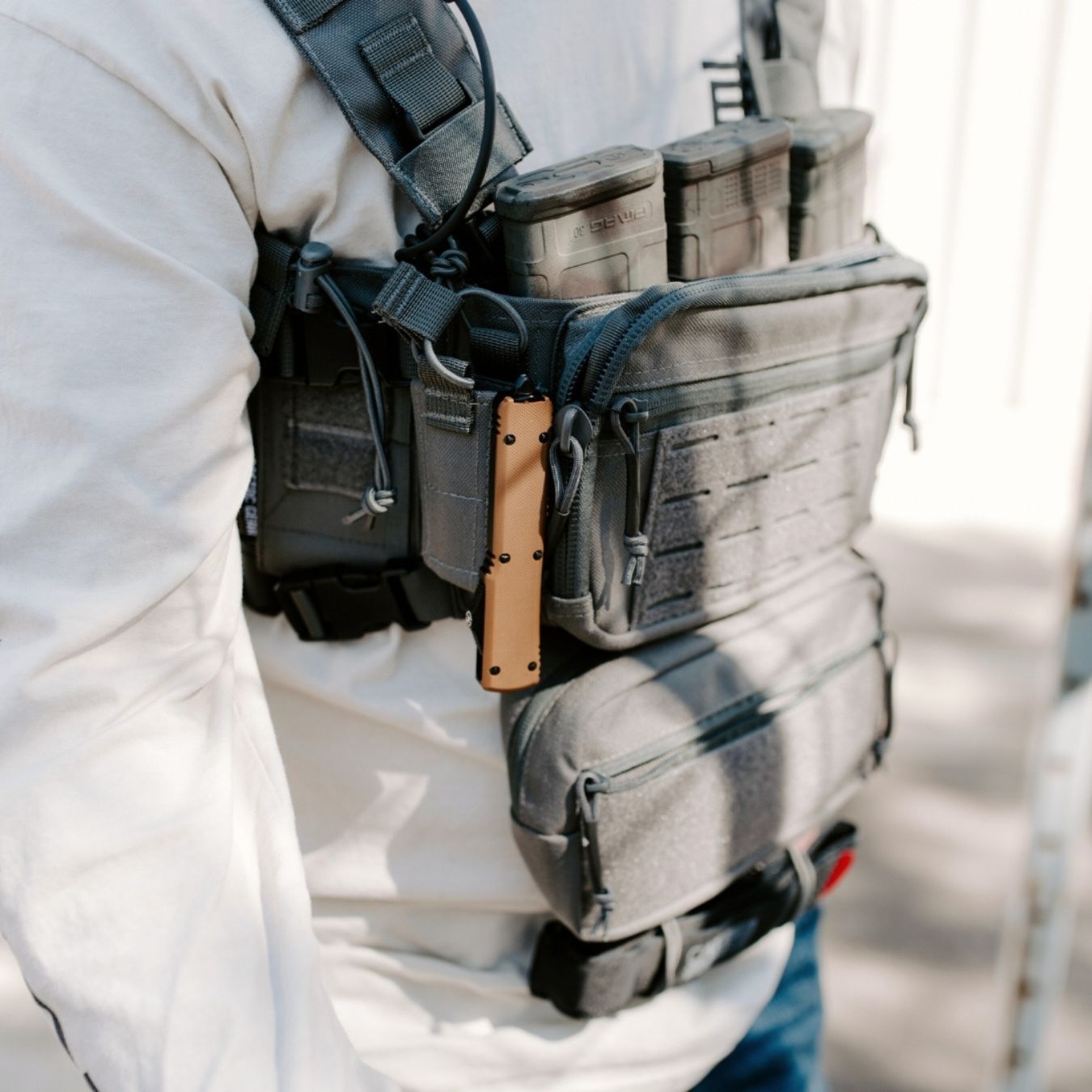 sandstorm otf knife being carried in a utility bag