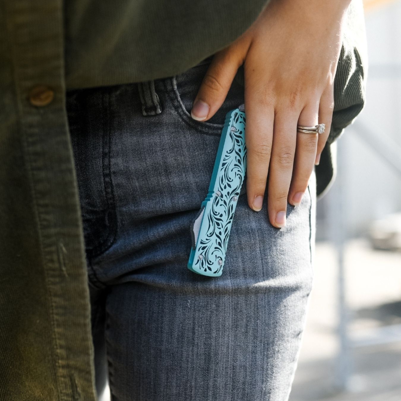 woman carrying serenity otf knife on front pocket