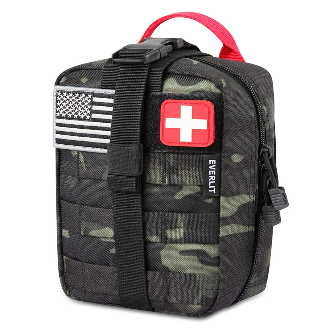 black camouflage backpack with American flag and medical cross patch on a white background