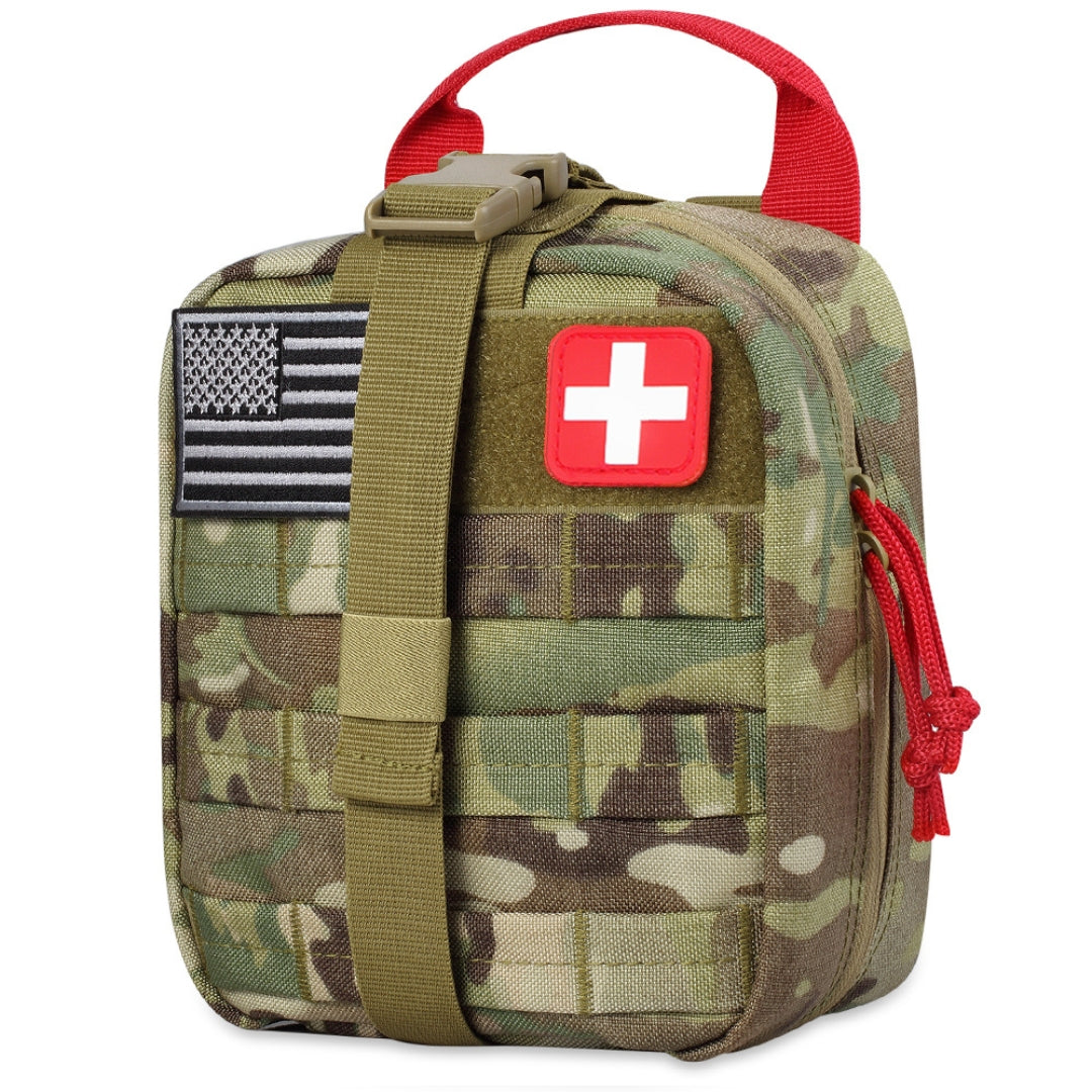 Camouflage medical trauma kit with American flag and red cross patch on a white background