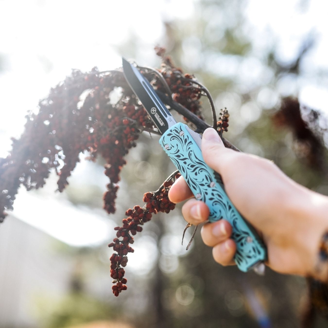 serenity women's otf knife with blue and black paisley design