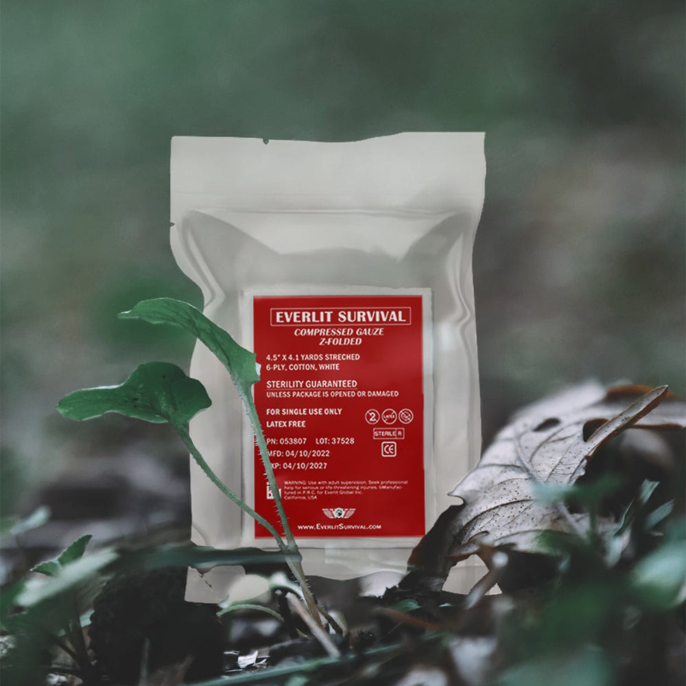 Everlit Survival compressed gauze package with a red label on a natural background